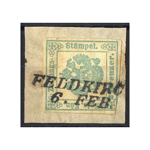 1853, "FELDKIRC(H) / 6. FEB.", Langstempel auf Zeitungsstempelmarke 2 Kr. blaugrün, Type Ia, auf Briefstück (Mü. 669a)